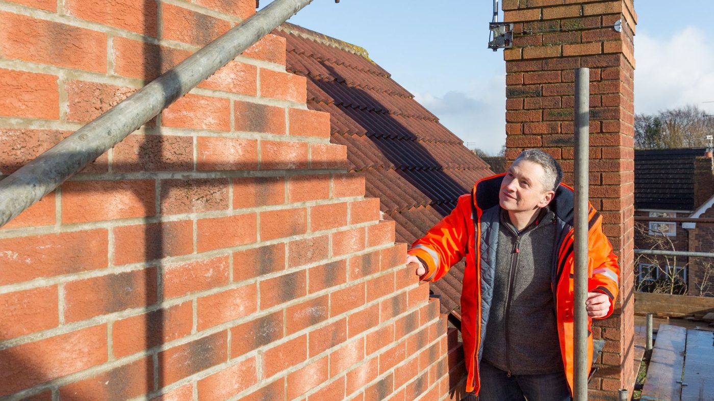 A newly built blockwork wall along a property boundary